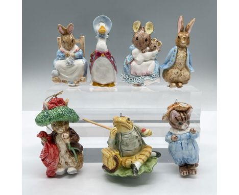 Features porcelain figures of Mrs. Rabbit on a rocking chair, Hunca Munca and baby on a rocking chair, Peter Rabbit, Benjamin