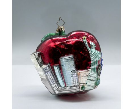 Features a large apple with New York City sky scrapers and the Statue of Liberty throughout it's perimeter. Glitter and gilde