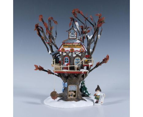 This is the lighted Oakwood Post Office Branch #56.56881 that measures 8"L x 5"W x 10"H and a tiny elf figurine posting his l