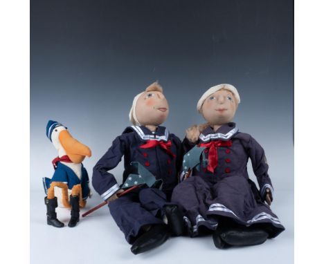 Handmade, hand decorated dressed in blue and white sailor suits carrying pinwheels ready for Fourth of July holiday. Accompan