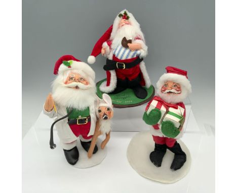 Charming collection of holiday figures that includes a doctor Santa with a stethoscope and a doe, a Santa holding a couple of