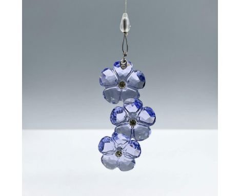 Dazzling purple crystal flowers with a sparkling yellow crystal center. Attached to a retractable monofilament, includes a wh