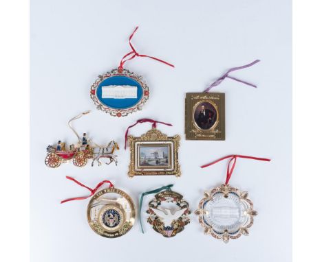 Elegant collection of holiday tree decor that consists of a 1996 circular model of the white house, a 1997 gilded frame, a 19