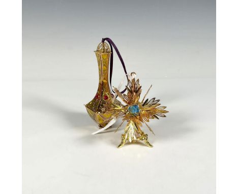 Handcrafted pair of ornaments featuring the Imperial Kildare Drop, adorned with shining ruby gems that complement an intricat