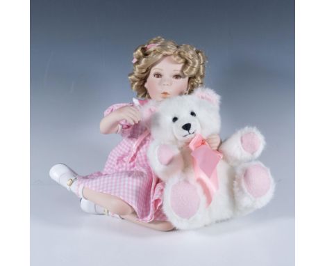 This piece features porcelain, hand-painted face and head, dressed in a beautifully recreated costume from one of her iconic 