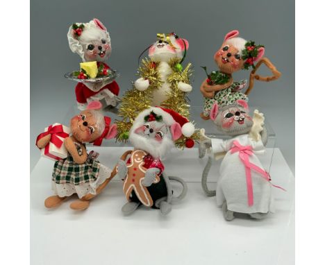 Stunning collection of holiday figurines that consists of mouse holding a gingerbread cookie, a mouse holding a cheese block 