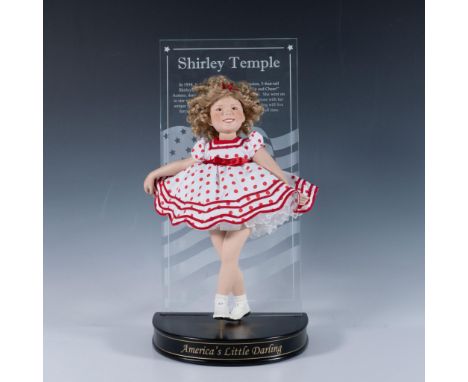 This doll honors Shirley Temple and her movie career by striking one of her iconic poses. Doll measures 9.5"L x 4.25"W x 12"H