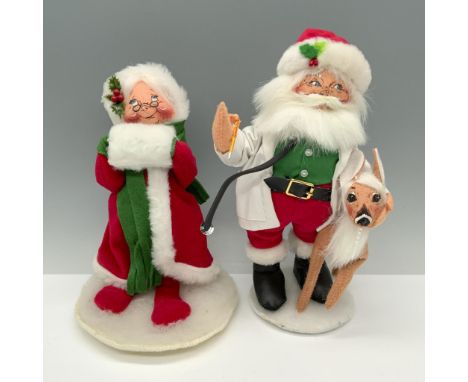Beautiful duo of dolls that consists of Mrs. Claus wrapped in a robe, and a doctor Santa with a deer. Annalee tag on both ite