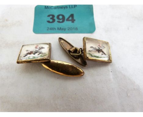 A pair of vintage gentleman's racing scene cufflinks