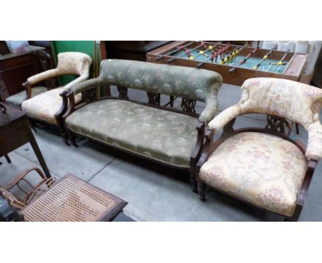 An Edward VII four piece salon suite comprising a sofa, a pair of armchairs and a side chair