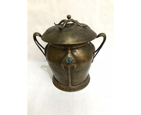 A Liberty & Co Arts and Crafts patinated brass coal bucket and cover, the stylised raised decoration inset with 'Ruskin' cera