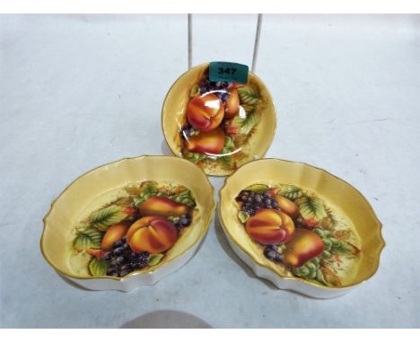 Aynsley Orchard Gold. A pair of shaped trinket dishes and a round example