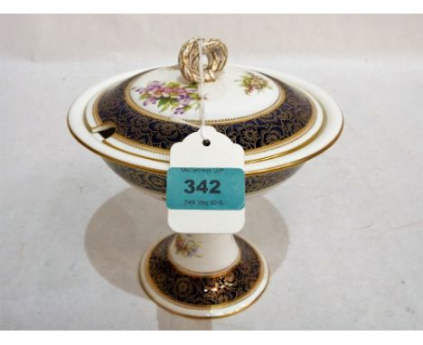A Royal Worcester comport tureen and cover, painted with flower sprays, blue banded and gilded. 7'' high. Hair crack