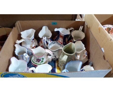 A collection of 13 Victorian ceramic jugs