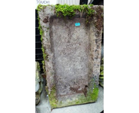 A weathered stone trough planter. 36'' wide