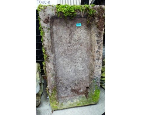 A weathered stone trough planter. 36'' wide