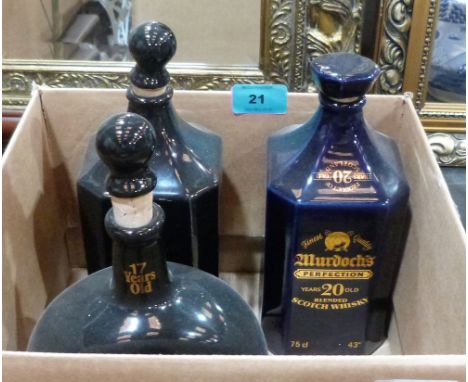 Three black or blue glazed advertising bottles; Black Prince Scotch Whisky; Murdochs Perfection Scotch Whisky and Speyside Wh