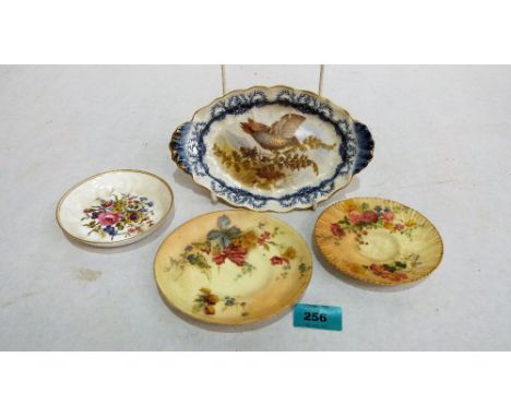 A Royal Worcester dish, finely painted and gilded with a game bird, 8'' wide; together with three small Royal Worcester dishe