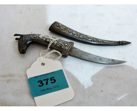 An Indo-Persian silver inlaid dagger, with horse head terminal. 6½'' long