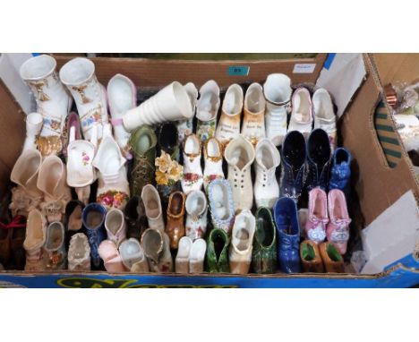 A collection of Victorian and later ceramic shoe ornaments