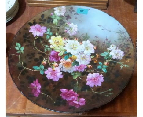 A continental ceramic charger painted in colours with wild flowers. Signed J.B David. 14½'' diameter