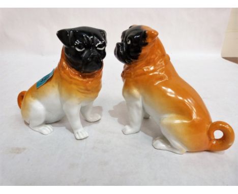 A pair of late 19th century ceramic pug dogs. 6¼'' high