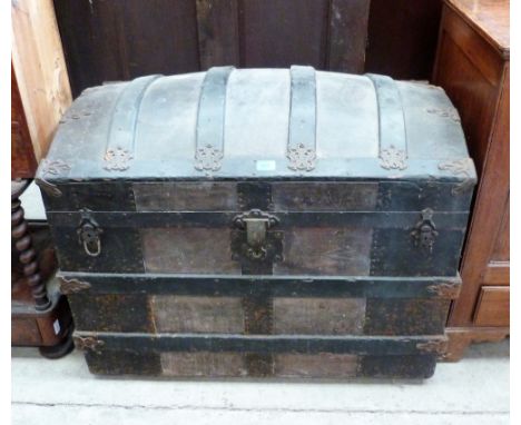 A 19th century dome top trunk with tooled leather panels and wood strapping. 36'' wide
