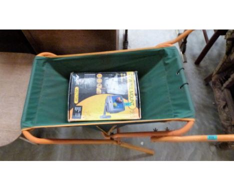 A folding wheelbarrow, a weights bench and a TV bracket