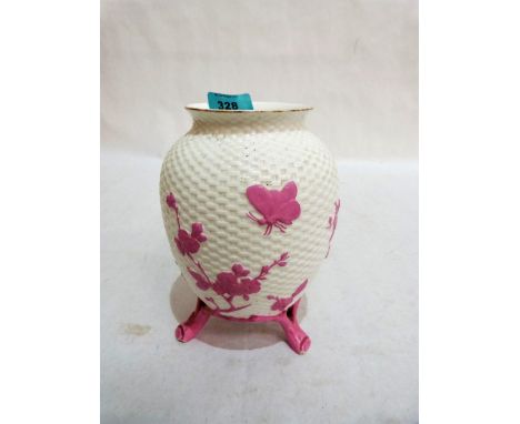 A basket weave moulded ceramic vase with pink foliate decoration. 7¼'' high. One foot re-stuck