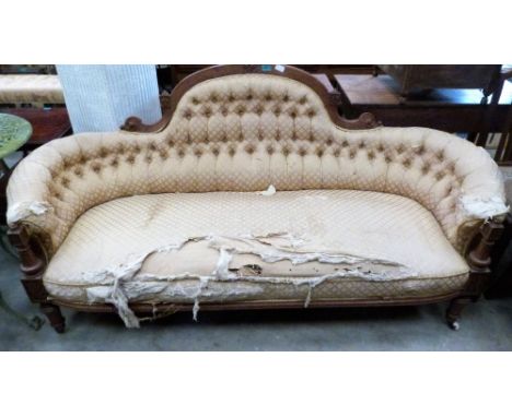 A Victorian walnut sofa with deep buttoned upholstery. 72'' wide