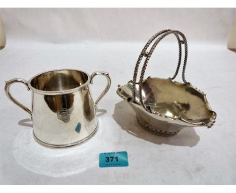 A continental white metal basket with double twist handle, 6½'' wide, together with an Elkington Plate sucrier engraved 'Anch