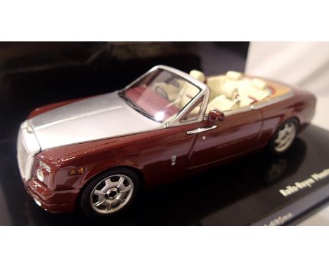 Minichamps 1/43 scale Rolls Royce Phantom Drophead Coupe, metallic red/silver in very near mint condition, boxed. P&amp;P Gro