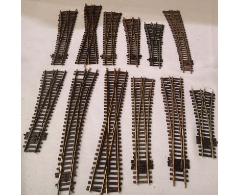 Twelve OO scale Peco points/crossings, weathered ex layout condition. P&amp;P Group 1 (£14+VAT for the first lot and £1+VAT f