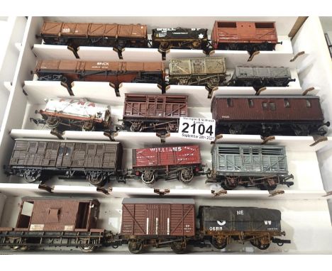 Fifteen OO scale wagons, various types and makes, mostly weathered in Warley storage box. P&amp;P Group 2 (£18+VAT for the fi