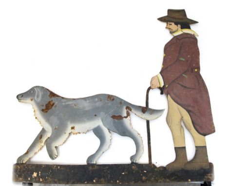 A painted weather vane of a man walking his dog, 61cm by 62cm