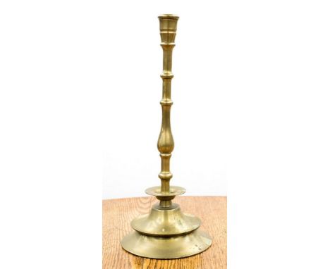 A 19th Century brass candlestick, 50cm high 