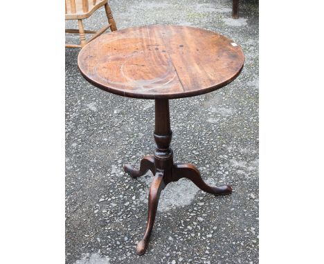 A George III mahogany tripod table, with a tilting top, 72cm high, 58cm in diameter