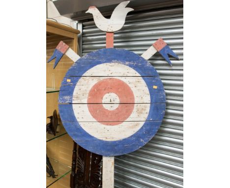 A vintage wooden painted target sign with bird motif finial, height 215cm