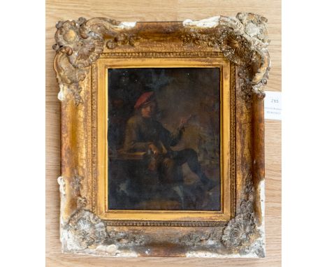 Dutch School, 19th Century, a young gentleman smoking a pipe in a tavern interior, oil on tin, in a 19th Century gilt frame 