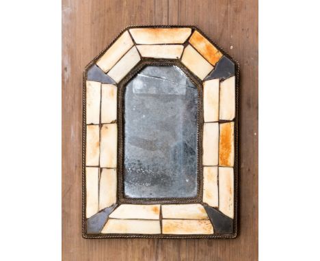 A small 19th Century mirror with segmented bone surround in a leather pouch, height 20cm