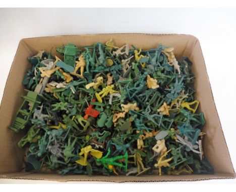 A group of 1:32 scale plastic soldiers. 