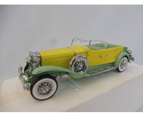 A Franklin Mint 1930 Duesenberg J Derham Tourster, 1:24 scale, boxed. 
