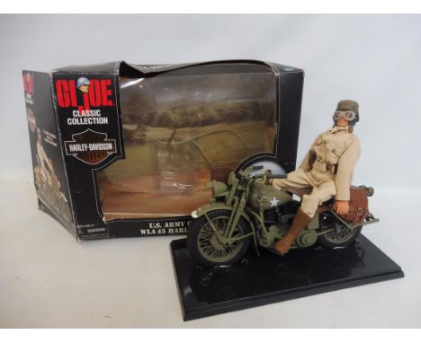 A Hasbro GI Joe figure with box of US Army Courier WOA45 Harley Davidson, complete standing figure. 