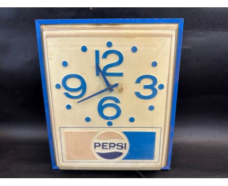 A circa 1980s wall clock advertising Pepsi, 13 1/2" w x 16" h x 5 1/2" d.