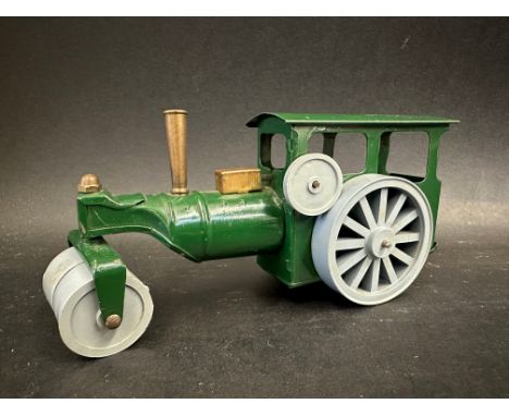 A Tri-ang Minic clockwork tinplate steam road roller, good condition.