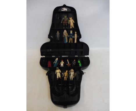 A Star Wars carry case in the shape of Darth Vader, first release, with a selection of original figures inside.