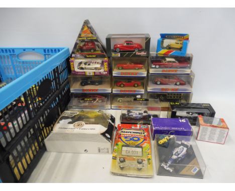 A collection of 30 boxed assorted scale die-cast models to include Matchbox, Dinky, Revel, Solido, Newray, Onyx, Minichamps, 
