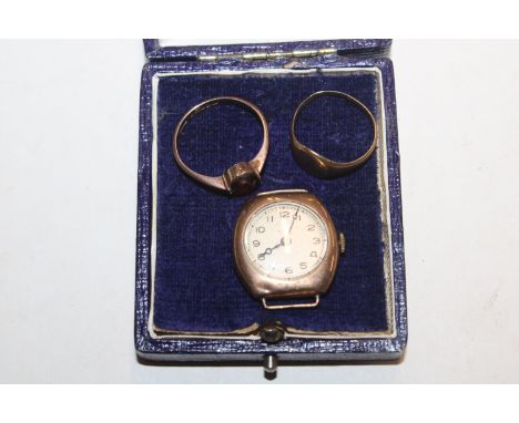A 9ct gold ring set with red stone; a gold ring marks rubbed 3.8gms total weight and a vintage 9ct gold cased wrist watch lac
