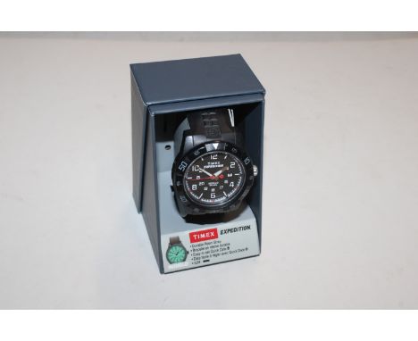 A Timex Expedition Indiglo light and dated watch in original box 