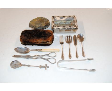 A box of various silver plated cutlery to include grape scissors, white metal caddy spoon, an Oriental figural decorated box 